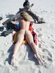 Busty chick shows her naked body at the nude beach
