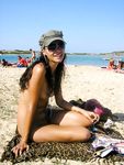 Raven haired goddess nudist shows off her body