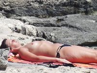Raven haired goddess nudist shows off her body
