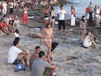 Raven haired goddess nudist shows off her body