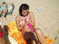 Sunlit Shoreline Nude Beach Wade with Hair in a Bun
