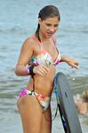 Sunlit Shoreline Nude Beach Wade with Hair in a Bun