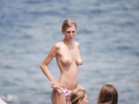 Helping Hand at the Nudist Beach
