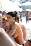 girl nudists get naked and heat up a public beach