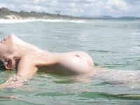 girl nudists get naked and heat up a public beach
