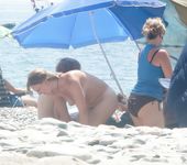 Gorgeous nude teen with a nice ass sunbathes