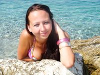 Adult naturist friends naked together at the beach