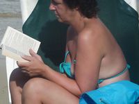 Adult naturist friends naked together at the beach