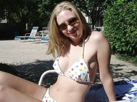 Topless Dancing on a Sunny Beach Full of Seaside Crowds