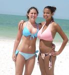 At the nudist beach teen girls play around naked