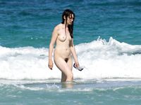 Hairy nudist girl cooking
