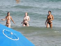 Hot babe sunbathes on nude beach