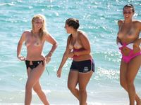 Hot babe sunbathes on nude beach