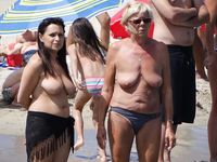 Hot babe sunbathes on nude beach