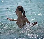 All eyes are on this adult naturist as she sunbathes