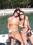 Topless Sunbathing With the Ocean Stretching Behind Her
