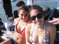 Nudist girls have fun with each other at the beach