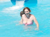 A pair of nudist adult friends steam up the beach