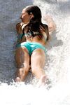 A pair of nudist adult friends steam up the beach