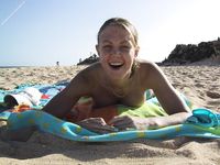 Two Women Lounge Topless in an Outdoor Pool