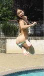 Carrying a Blue Inflatable Ring Along a Nude Beach
