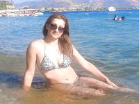 Castrated sissy at the nude beach
