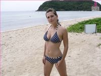 Castrated sissy at the nude beach