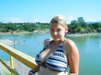 Castrated sissy at the nude beach