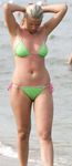 Curvy young nudist lets the sun kiss her body
