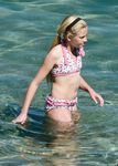 Curvy young nudist lets the sun kiss her body