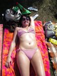 Curvy young nudist lets the sun kiss her body