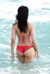 Dark haired nudist beach teen gets an all over tan