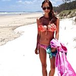Dark haired nudist beach teen gets an all over tan