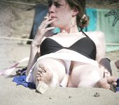 Gorgeous wet Russian nudist sunbathes naked