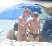 A game of badminton played between teen nudists