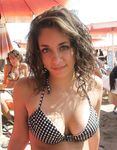 Laughing and Untying a Red Bikini Top on a Topless Beach