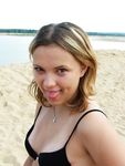 Laughing and Untying a Red Bikini Top on a Topless Beach