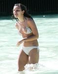 Laughing and Untying a Red Bikini Top on a Topless Beach