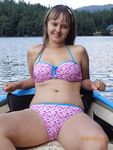 Laughing and Untying a Red Bikini Top on a Topless Beach
