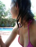 Laughing and Untying a Red Bikini Top on a Topless Beach