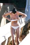 Two skinny nudist girls frolic around the beach