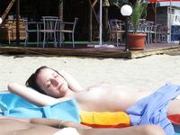 Having fun is easy at the beach for two nude teens