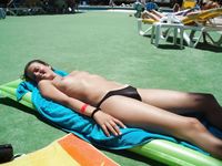 Having fun is easy at the beach for two nude teens