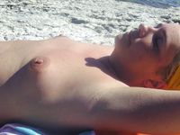 Amazing shots of a gorgeous nudist babe sunbathing