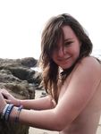 Holding a Paddle Racket on a Nude Beach Shoreline