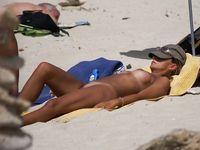 Adult adult naturist lays naked at the beach