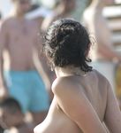 Adult adult naturist lays naked at the beach