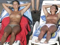 Adult adult naturist lays naked at the beach