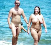 Slim girl with perky boobs naked at a nudist beach