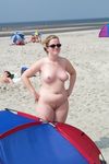 Gorgeous wet adult naturist plays in the water